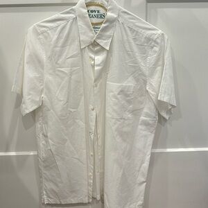 Theory. White short sleeved button down. Pocket on left breast.